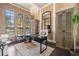 Office with hardwood floors, decorative chandelier, and large windows allowing natural light at 8434 Dunham Station Dr, Tampa, FL 33647
