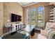 Office with hardwood floors, decorative chandelier, and large windows allowing natural light at 8434 Dunham Station Dr, Tampa, FL 33647