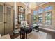 Office with hardwood floors, decorative chandelier, and large windows allowing natural light at 8434 Dunham Station Dr, Tampa, FL 33647
