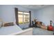 Bedroom offering a window view and a place to study at a desk at 8529 Regal Ln, Hudson, FL 34667