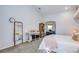 Light-filled bedroom boasts a mirror, shelving, and comfortable furnishings at 8529 Regal Ln, Hudson, FL 34667