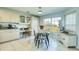 Bright breakfast area featuring a cozy table and views of the outdoors at 8529 Regal Ln, Hudson, FL 34667