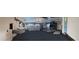 Spacious garage with overhead storage, an automatic door, and ample room for vehicles and projects at 8529 Regal Ln, Hudson, FL 34667