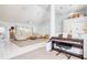 Spacious living room with vaulted ceilings, natural light, and open access to the kitchen and dining area at 8529 Regal Ln, Hudson, FL 34667
