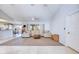 Expansive living room with an open layout, featuring a neutral color palette and access to the kitchen at 8529 Regal Ln, Hudson, FL 34667