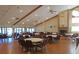 Large meeting room with tables, chairs, and a fireplace at 9529 Bunker Hill Ct, New Port Richey, FL 34655