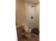 Modern bathroom with a stylish vanity, toilet, and a beautifully tiled walk-in shower at 10116 N Highland Ave, Tampa, FL 33612
