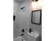 Stylish bathroom featuring modern fixtures, marble-like tiling, and a sleek vanity at 10116 N Highland Ave, Tampa, FL 33612