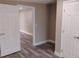 Bright bedroom featuring new floors with neutral wall paint and white trim doors at 10116 N Highland Ave, Tampa, FL 33612