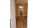 Bedroom with wood floors and view to a bathroom at 10116 N Highland Ave, Tampa, FL 33612