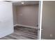 Neutral bedroom showcasing fresh paint, new flooring, and white trim, with closet and ensuite access at 10116 N Highland Ave, Tampa, FL 33612