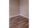 Cozy bedroom featuring durable wood flooring and neutral wall paint at 10116 N Highland Ave, Tampa, FL 33612