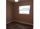 Bedroom with fresh paint and a bright window at 10116 N Highland Ave, Tampa, FL 33612