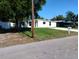 An exterior elevation of a single-story home on a sunny day at 10116 N Highland Ave, Tampa, FL 33612
