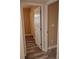 Neutral hallway leads to another room with white trim doors at 10116 N Highland Ave, Tampa, FL 33612
