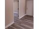 Hallway with hard surface floors and neutral paint at 10116 N Highland Ave, Tampa, FL 33612