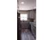 Contemporary kitchen features granite counters and stainless steel appliances at 10116 N Highland Ave, Tampa, FL 33612