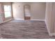 Living room with fresh paint, new flooring, and bright window at 10116 N Highland Ave, Tampa, FL 33612