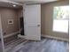 Updated utility room with new flooring, paint, trim, lighting, and appliances at 10116 N Highland Ave, Tampa, FL 33612