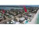 Aerial view of the property showing nearby beach access and beautiful views of the surrounding neighborhood at 110 8Th St, Belleair Beach, FL 33786