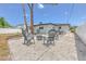 Relaxing backyard setup with a fire pit surrounded by comfortable seating, perfect for outdoor enjoyment and entertaining at 110 8Th St, Belleair Beach, FL 33786