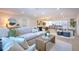 Comfortable living space flowing into dining and kitchen areas, perfect for entertaining guests at 110 8Th St, Belleair Beach, FL 33786