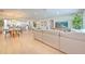 Spacious open-concept living area with a modern kitchen, dining area, and inviting living space at 110 8Th St, Belleair Beach, FL 33786