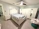 Spacious bedroom with a ceiling fan, a bed, and lots of storage at 11303 Hollyglen Dr, Tampa, FL 33624