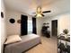 Single bed bedroom with ceiling fan, large window and converted to workspace at 11303 Hollyglen Dr, Tampa, FL 33624