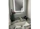 Charming bathroom vanity has a modern sink and lighting at 11727 Spanish Lake Dr, Tampa, FL 33635