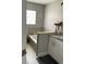 Bathroom with tiled bathtub and vanity with sink at 11727 Spanish Lake Dr, Tampa, FL 33635