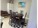 Formal dining room features a decorative rug and natural light at 11727 Spanish Lake Dr, Tampa, FL 33635