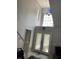 Entryway foyer features decorative windows, chandelier, and double glass front doors at 11727 Spanish Lake Dr, Tampa, FL 33635