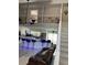 Open-concept kitchen with island, stainless steel appliances, and views to the upstairs loft at 11727 Spanish Lake Dr, Tampa, FL 33635