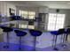 Bright kitchen featuring stone countertops, stainless steel appliances, and island seating at 11727 Spanish Lake Dr, Tampa, FL 33635
