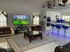 Bright living room featuring modern furniture, high ceilings, tile floors, and seamless open concept to kitchen at 11727 Spanish Lake Dr, Tampa, FL 33635