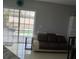 Living room with contemporary furniture, sliding glass doors and view of the pool at 11727 Spanish Lake Dr, Tampa, FL 33635