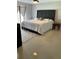 Spacious main bedroom features a stylish king bed and lots of natural light at 11727 Spanish Lake Dr, Tampa, FL 33635