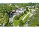 Stunning aerial view of a luxury home with lush landscaping and a private driveway at 124 Estado Ne Way, St Petersburg, FL 33704