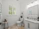 A modern bathroom with marble vanity, and neutral wall paint at 124 Estado Ne Way, St Petersburg, FL 33704