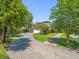 A long brick driveway leads to this home surrounded by lush, mature landscaping at 124 Estado Ne Way, St Petersburg, FL 33704