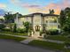 Elegant two-story home showcasing manicured landscaping and architectural details at 124 Estado Ne Way, St Petersburg, FL 33704