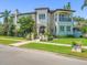 Impressive home boasts a manicured lawn, mature landscaping, and a covered balcony at 124 Estado Ne Way, St Petersburg, FL 33704