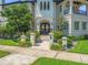 Striking home with a beautiful facade, manicured landscaping, and inviting entryway at 124 Estado Ne Way, St Petersburg, FL 33704