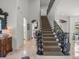 Grand foyer with an ornate staircase, marble flooring, and sophisticated décor creates a welcoming entrance at 124 Estado Ne Way, St Petersburg, FL 33704