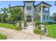 Stately home featuring an ornate front door, stone walkway, manicured landscaping, and classic architecture at 124 Estado Ne Way, St Petersburg, FL 33704