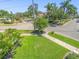 Well-maintained lawn and landscaping in a residential neighborhood, view from front yard at 124 Estado Ne Way, St Petersburg, FL 33704