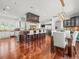 Modern kitchen with a large island, stainless steel appliances, and hardwood floors at 124 Estado Ne Way, St Petersburg, FL 33704