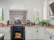 Gourmet kitchen with pizza oven, custom cabinets and countertop appliances at 124 Estado Ne Way, St Petersburg, FL 33704