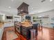 Gourmet kitchen featuring a large island, range, and stainless steel appliances at 124 Estado Ne Way, St Petersburg, FL 33704